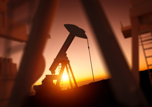 Oil and Energy Industry. A field of oil pumps against a sunset. Oil prices, energy and economic commodities.